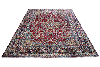 Rectangular red-and-blue patterned Oriental rug, laid flat (285x212 cm).