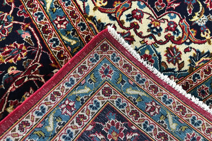 Close-up of a carpet edge with colorful patterns and a decorative border finish