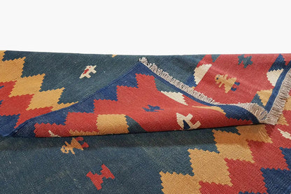 Kilim rug detail at the edge: interlocking zigzag patterns with fringes