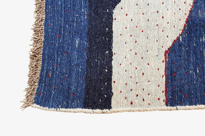 Kilim rug with fringes, blue-and-white areas, and red contour lines