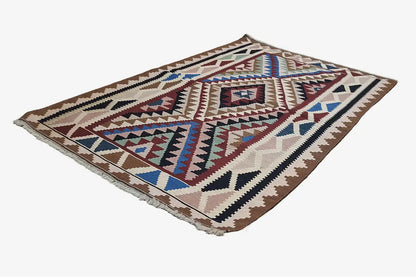 Kilim rug with a geometric pattern in brown, beige, blue, and red
