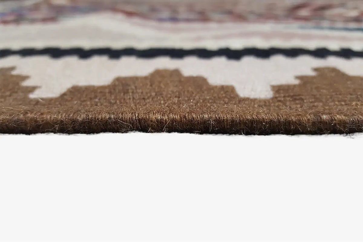 Close-up of carpet edge with pile and woven border