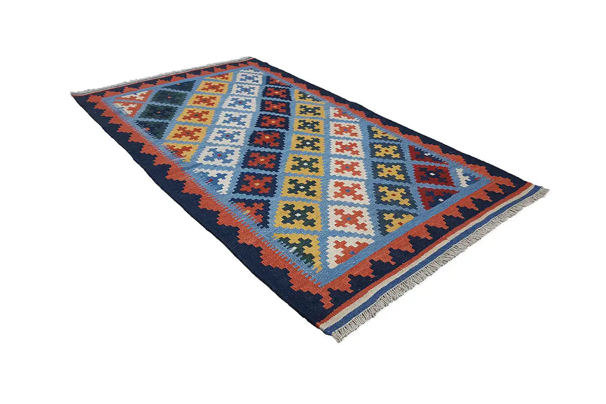 Multicolored kilim rug with a geometric pattern, diagonal view, fringes
