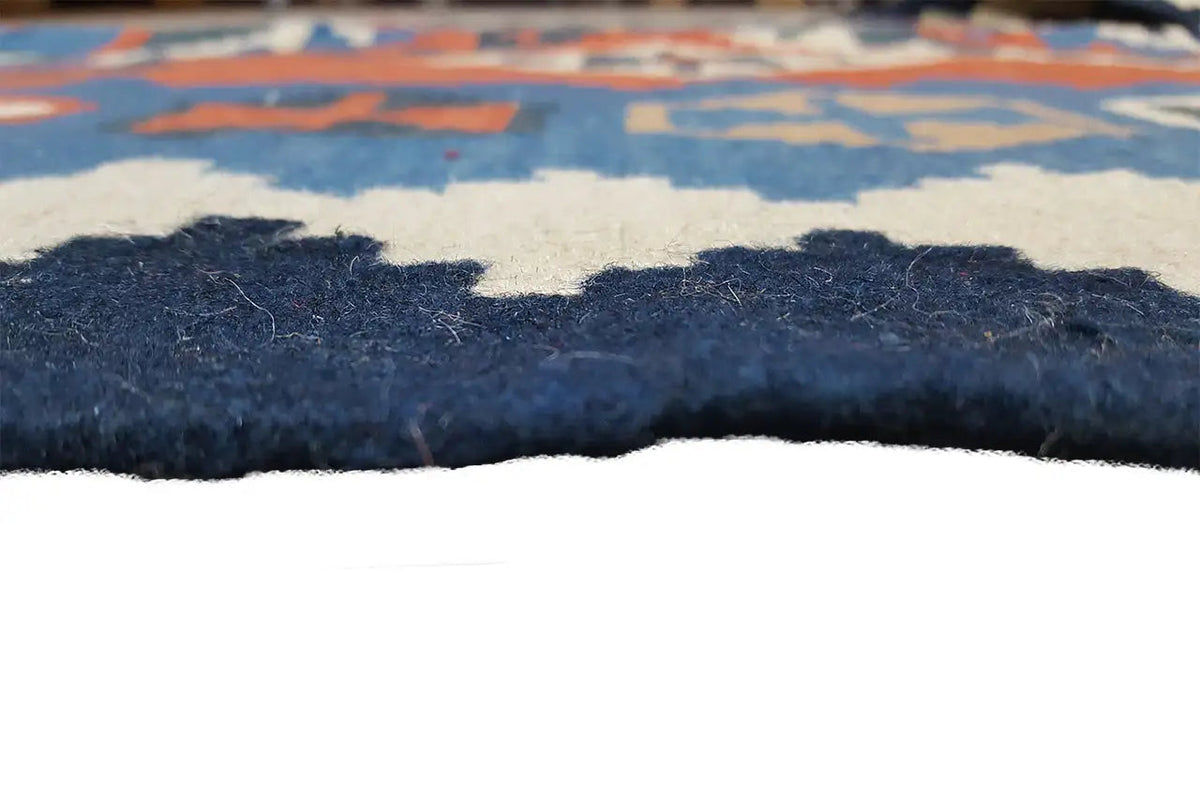 Kilim rug: side edge with short pile and fringes, blue-orange patterned