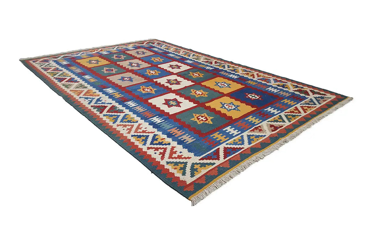 Kilim rug with a geometric medallion pattern, turquoise blue, yellow, and red accents