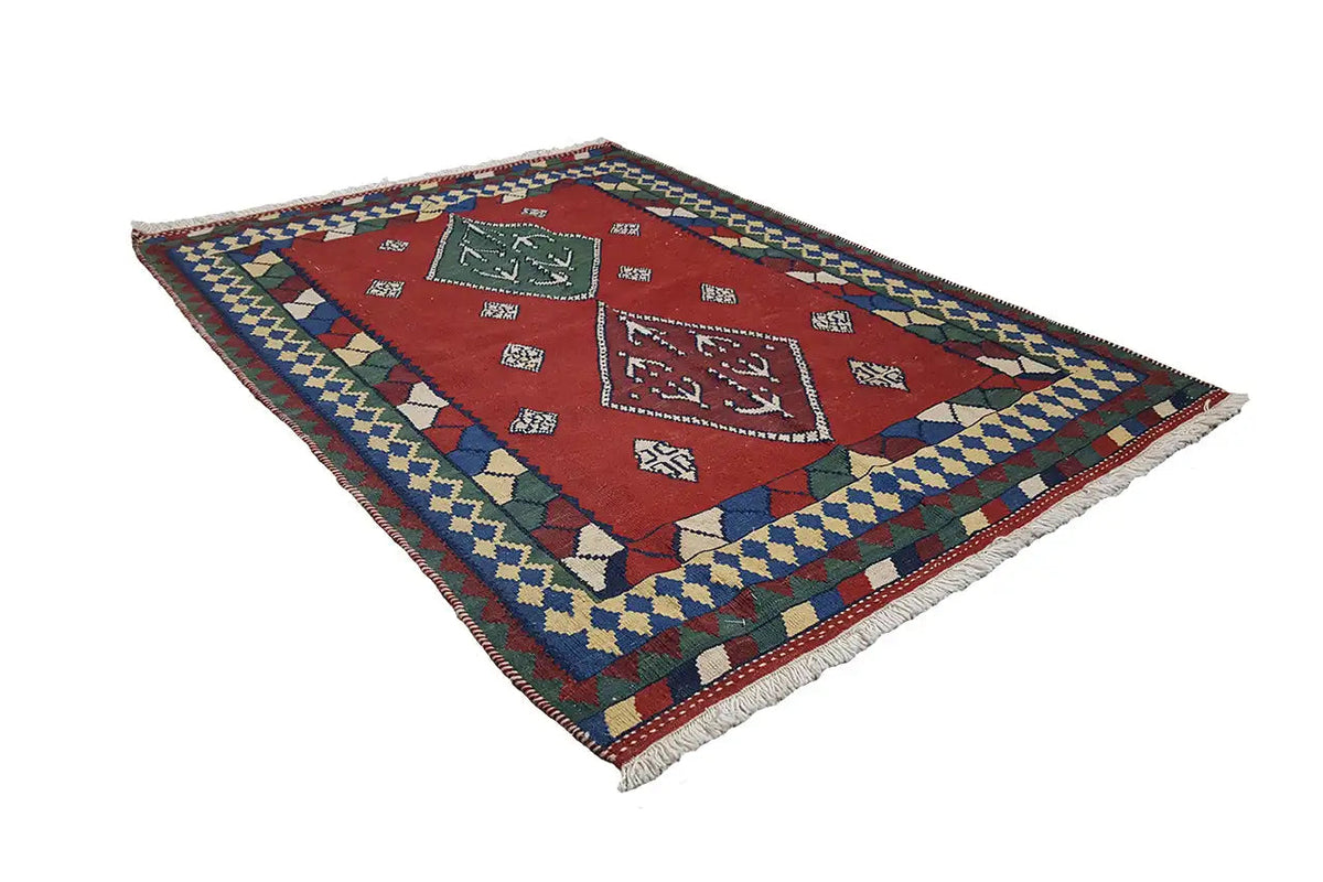 Multicolor kilim rug with a geometric design, multicolored border, and fringes