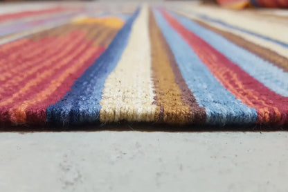 Kilim rug seam detail with a striped pattern and multicolored color blocks
