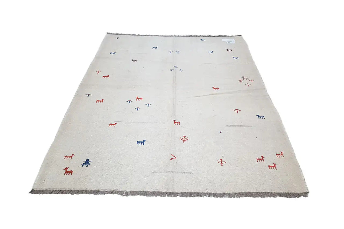 Light beige kilim rug with a small pattern of red and blue figures, frayed edges