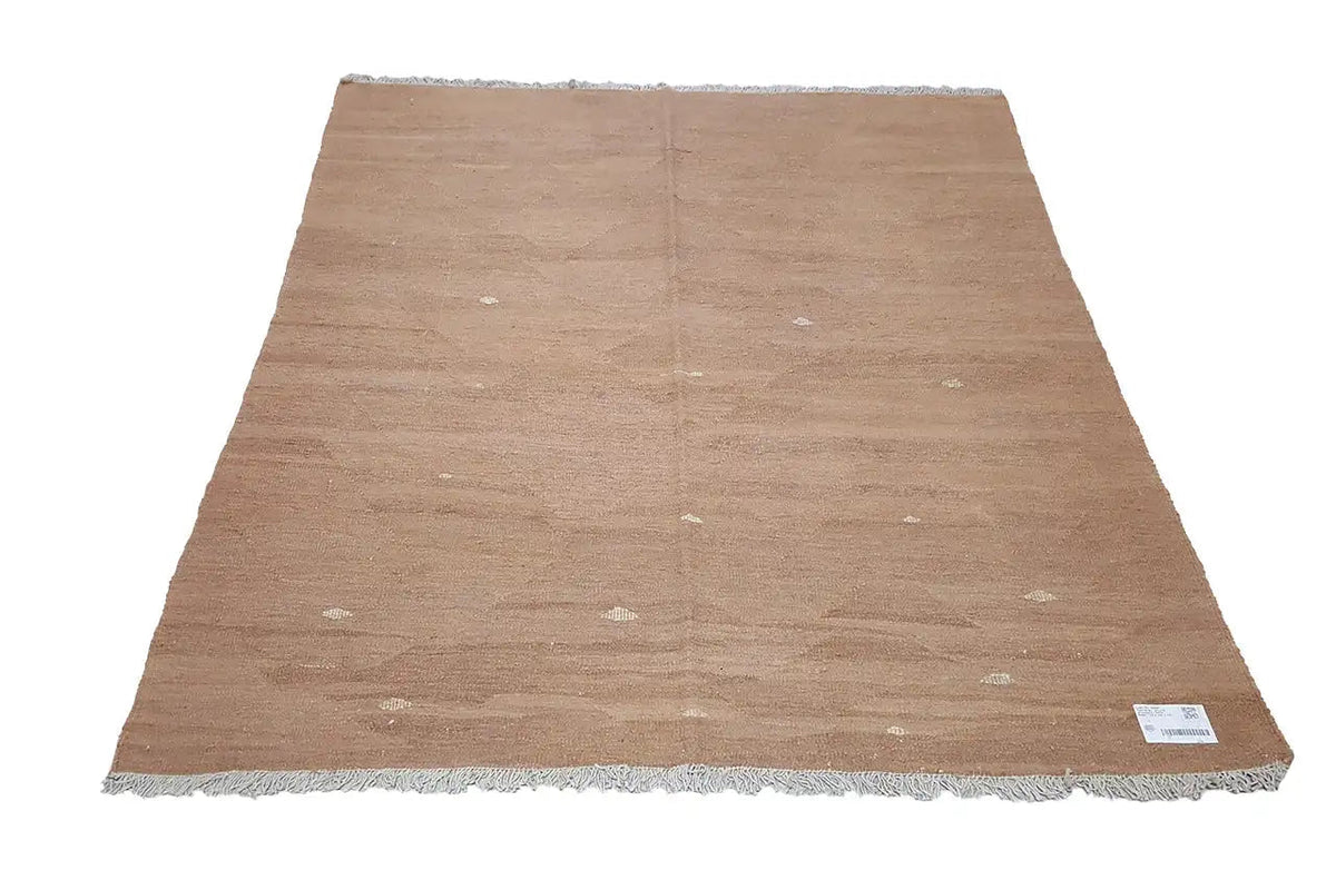 Brown flat-woven kilim rug with delicate light dots and fringes