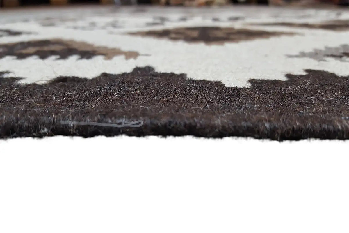 Kelim rug with a short pile, dark border and light cream-colored field