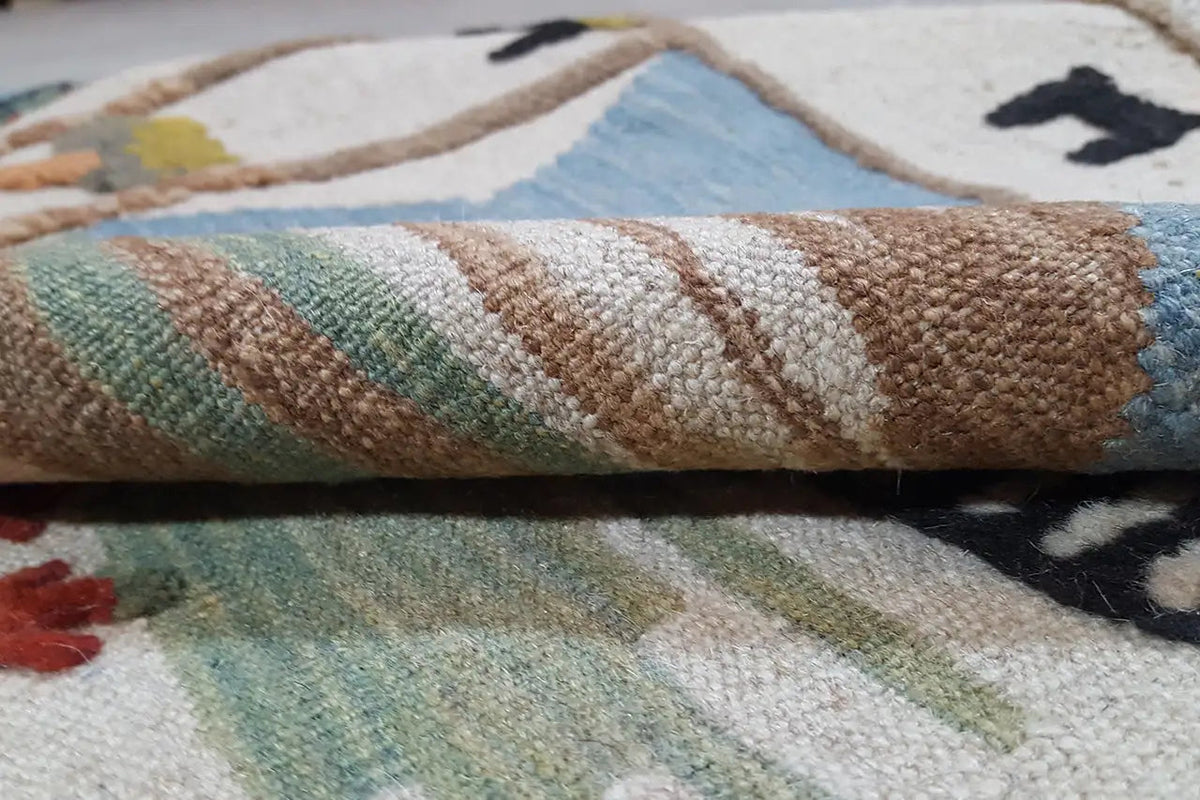 Kilim Qashqai rug: woven pile surface, close-up with colorful stripes
