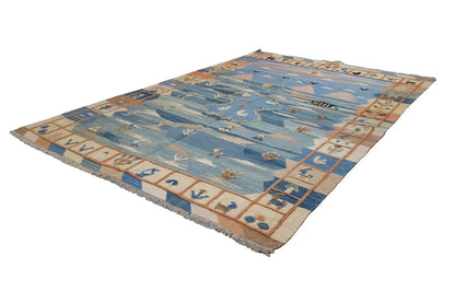 Blue kilim rug with ornaments and a surrounding border border