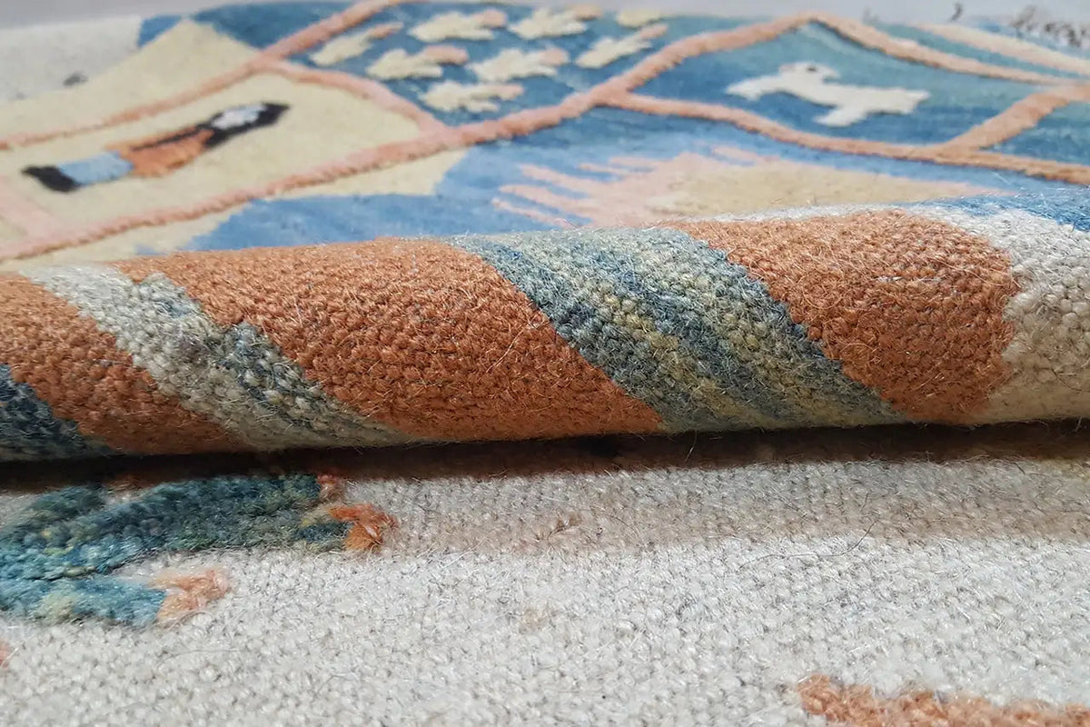 Kilim rug, detail of the woven structure with blue-beige and rust-brown color accents