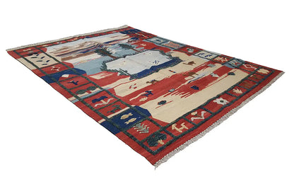 Kilim Qashqai rug with central medallion, red and blue color fields, fringe