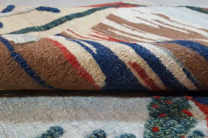 Kilim-Qashqai rug close-up: colorful woven stripes, dense pile at the edge