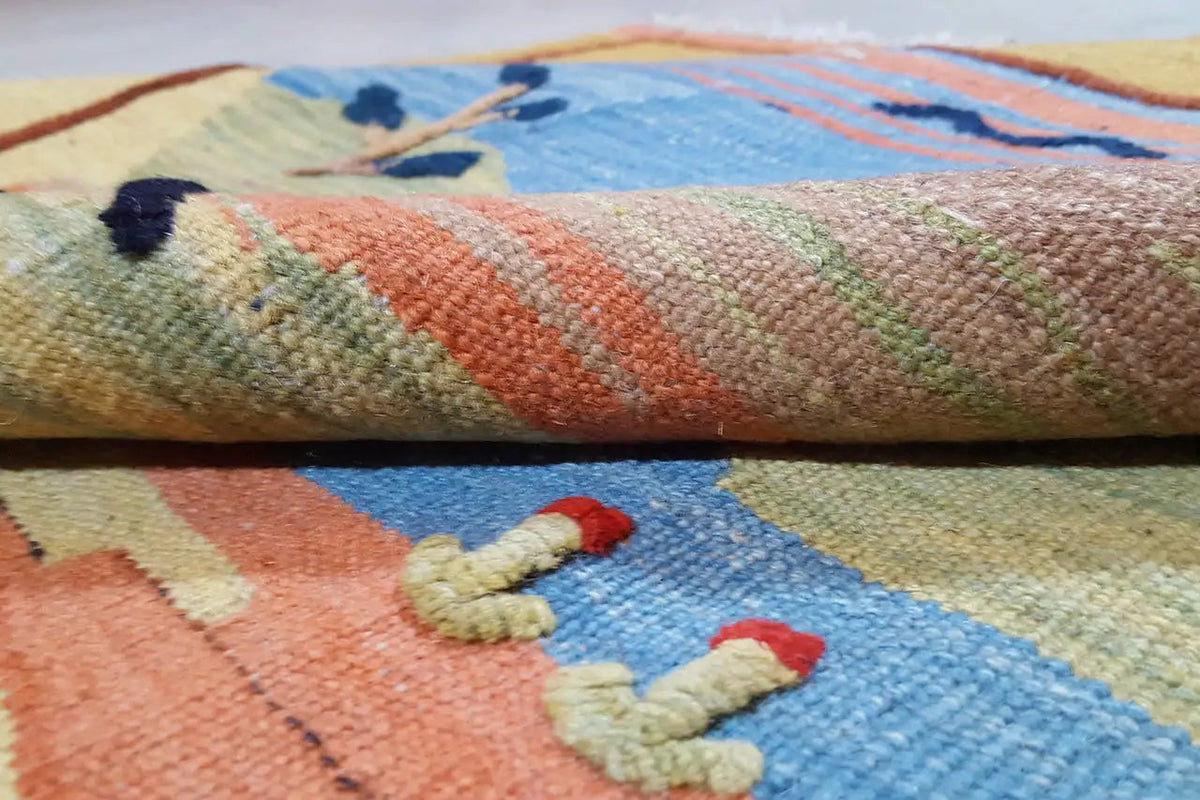 Kilim fabric in detail with colorful stripes and small ornamental motifs