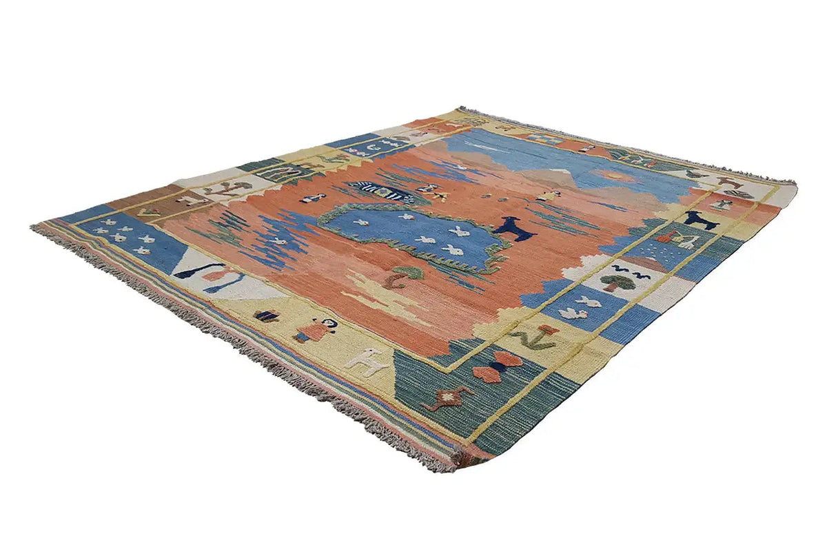 Pile rug with a blue and orange central motif and a multicolored border