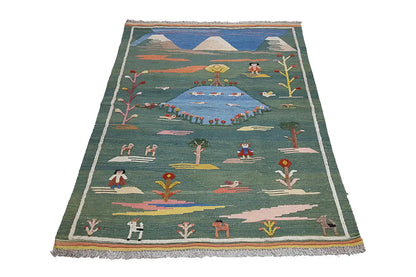 Green kilim rug with landscape motifs and a beige fringed edge, 147×100 cm