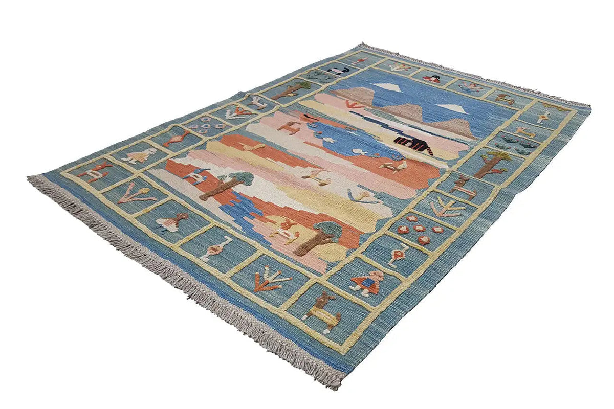 Kilim rug, shown rotated: blue-beige landscape with ornaments and fringes