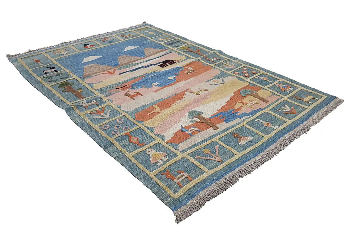 Kilim rug viewed diagonally from above: blue field with colorful figures and landscape forms