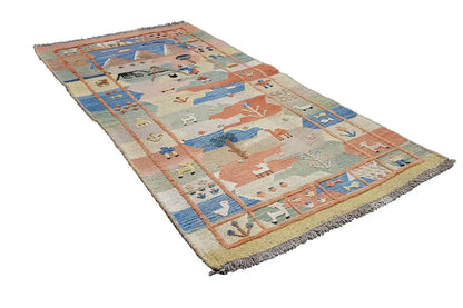 Oriental rug with pastel sections, animal motifs and fringes, wide border