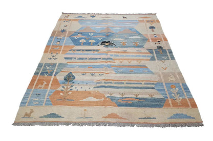 Kilim rug in blue and beige with orange-brown fields, geometric motifs, fringes.