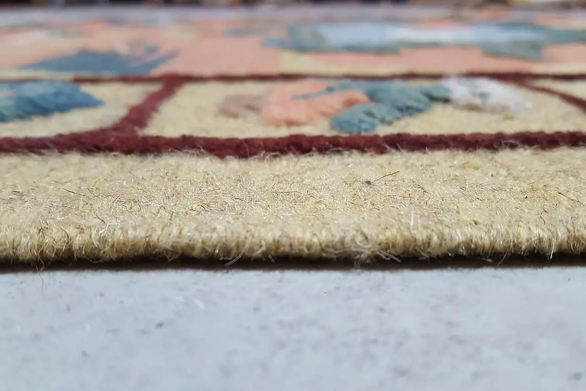 Kilim rug close-up of the fringe and selvage, multicolored patterned area.