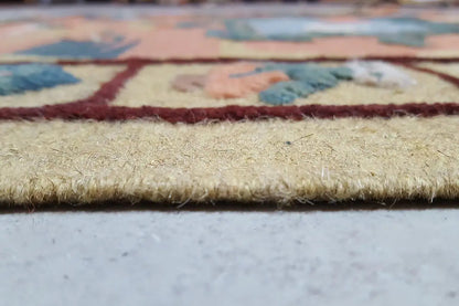 Kilim rug close-up of the fringe and selvage, multicolored patterned area.
