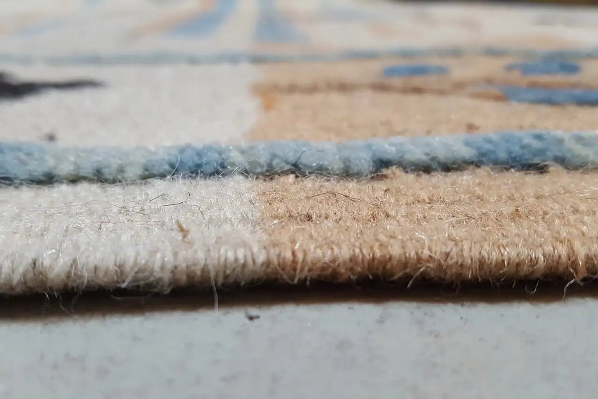 Kilim rug edge with short fringes and multicolored woven pile