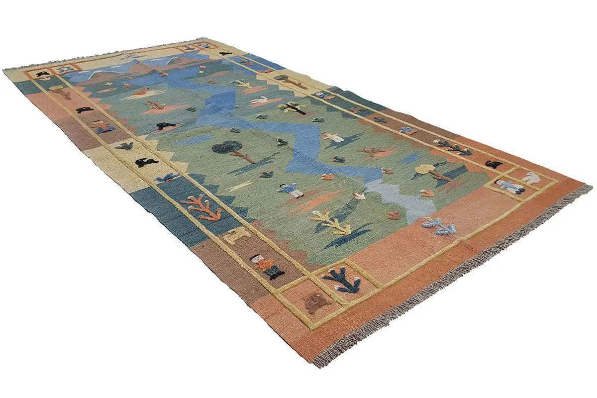 Kilim rug with a geometric zigzag pattern in blue, green, and brown, fringes