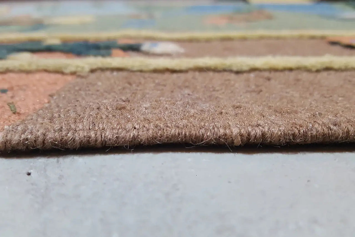 Kelim rug edge view with short pile and brown border