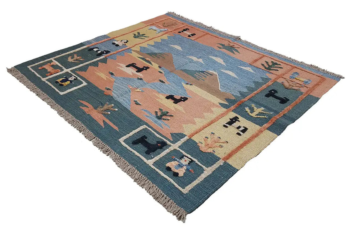 Kilim rug with a geometric pattern in orange, blue, and dark teal, with fringes
