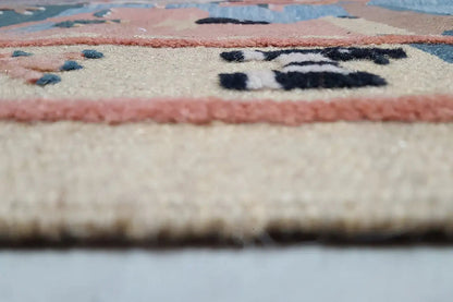 Close-up of the rug edge with fringe and a colorful geometric pattern