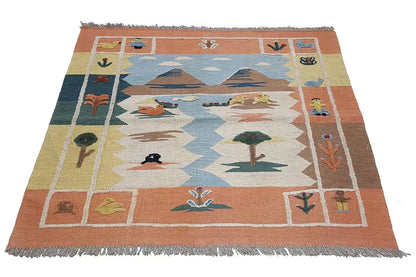 Kilim rug with a figurative pattern, blue central field, orange border, and fringes