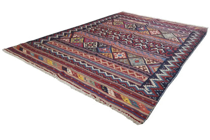 Kilim rug laid diagonally, colorful stripes and geometric patterns, rectangular