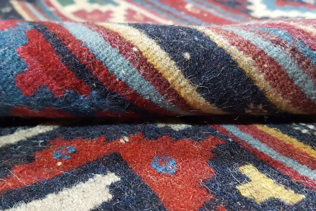 Kilim rug weaving detail: thick wool fibers with colorful ornaments