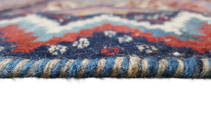 Kilim rug edge with a bound hem and short fringes, multicolored