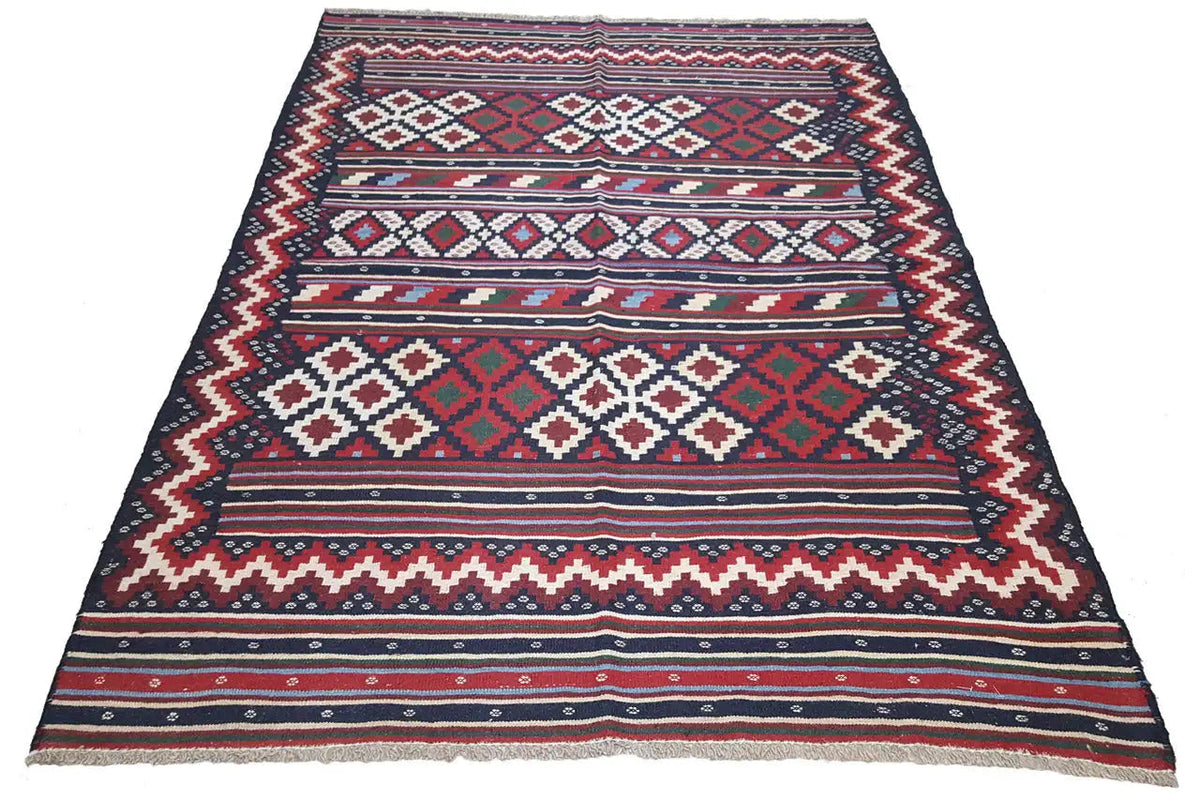 Kilim rug, spread out wide: geometric stripes and diamonds in blue and red