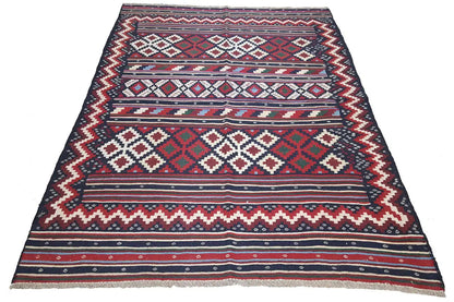 Kilim rug, spread out wide: geometric stripes and diamonds in blue and red