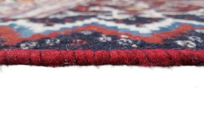 Kilim rug view of the edge with red fringes and a thick selvedge