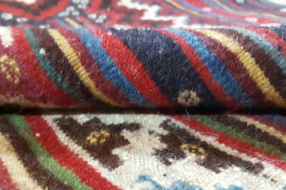 Kilim Sirjan kilim rug detail: dense pile with colorful stripes in red, blue, and green