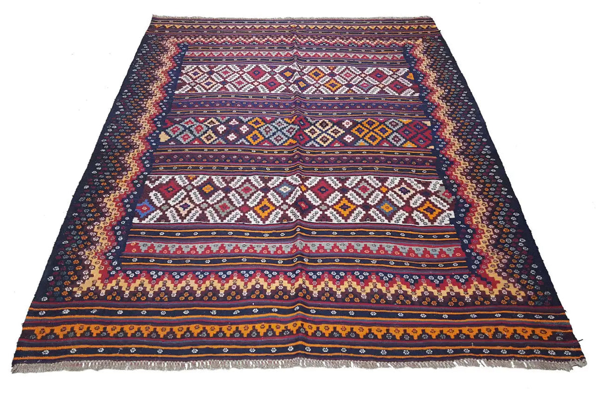 Kilim rug laid flat, geometric borders in blue and red
