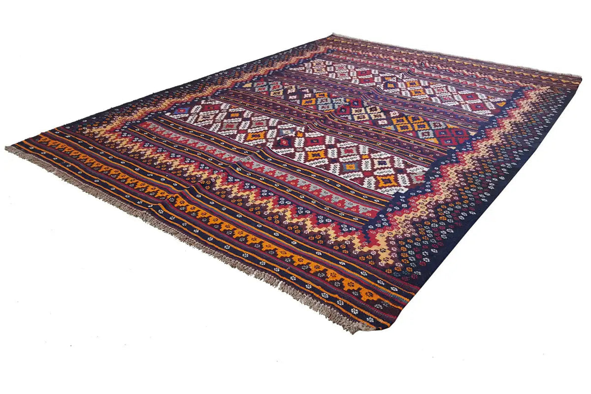 Kilim rug from above, diamond pattern with a dark blue border