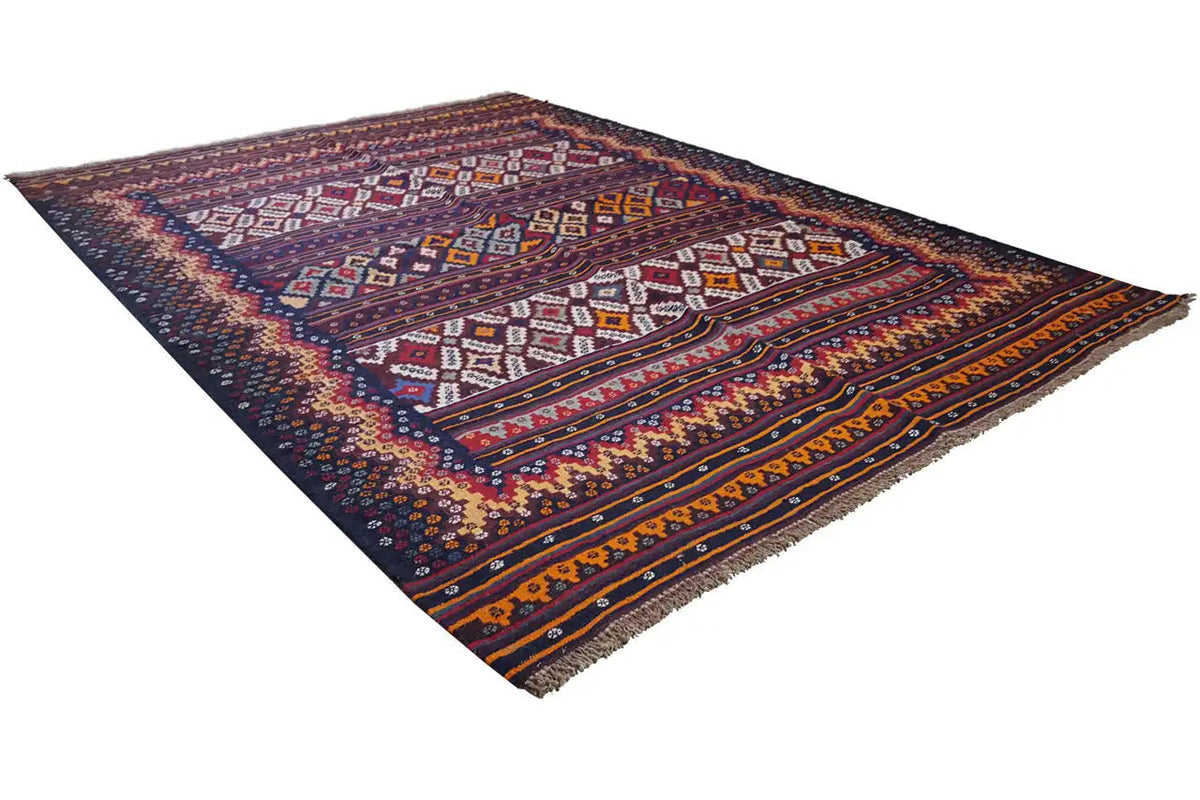 Kilim rug laid at an angle, geometric patterns in blue and orange