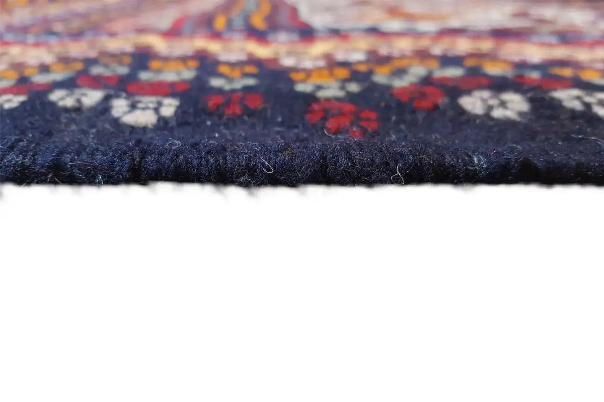 Kilim rug edge detail with fringe, dark surface and pattern
