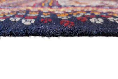 Kilim rug edge detail with fringe, dark surface and pattern