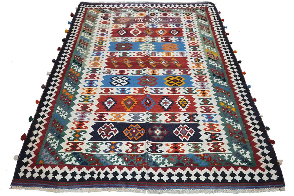 Qashqai kilim, colorful geometric pattern with a dark decorative border and tassels