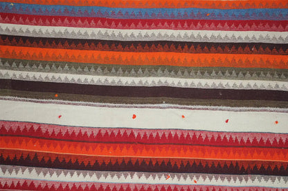 Jajim rug close-up: horizontal pattern in red, gray, and beige