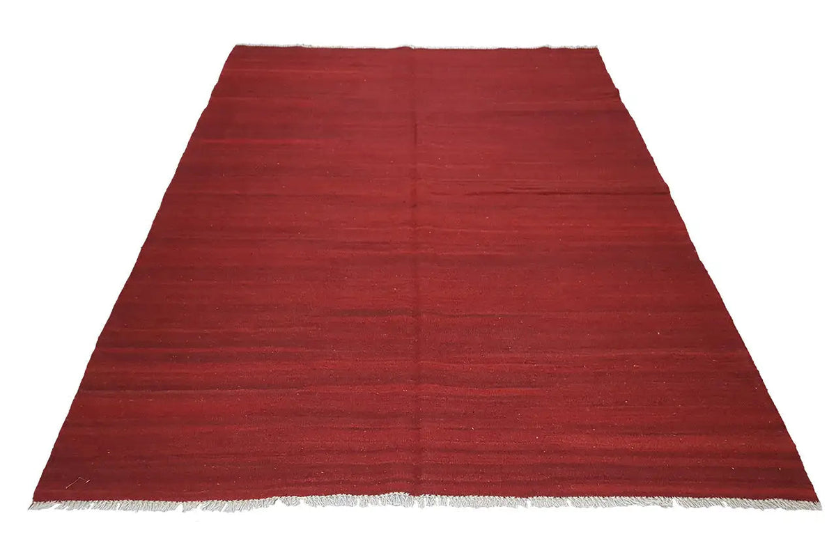 Red kilim rug Simple, rectangular, with an even surface and woven edge