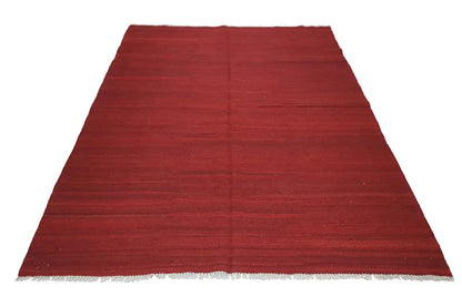 Red kilim rug Simple, rectangular, with an even surface and woven edge
